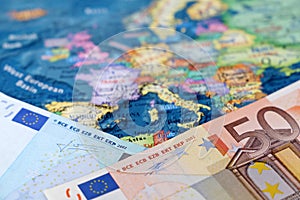 Euro banknotes on the Europe map