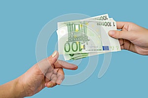 100 euro banknotes in female hands. The concept of corruption. to give a bribe. Giving or taking money. Hands with euro  o
