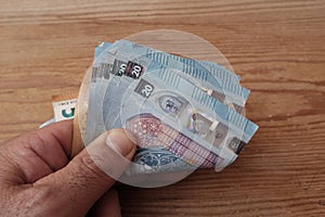 Euro banknotes in the hand