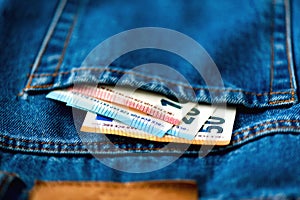 Euro banknotes in jeans pocket. Success, wealth and poverty, poorness concept. Euro currency background with copy space.