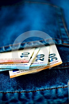 Euro banknotes in jeans pocket. Success, wealth and poverty, poorness concept. Euro currency background with copy space.