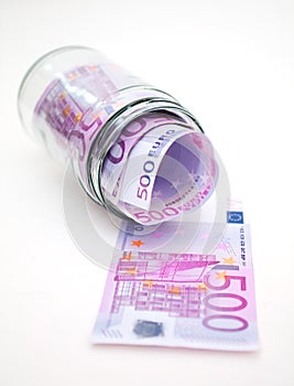 Euro banknotes in money jar