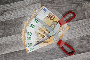 50 euro banknotes with scissors on top