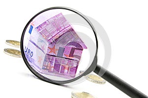 Euro bill House and expenses under magnifying glass