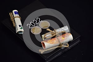 Euro bills 5 and 10 bills, and calendar notepad 2022