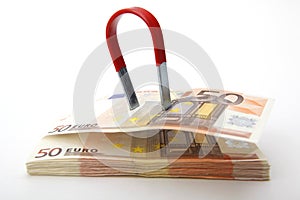 Euro bills attracted by a magnet