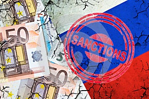 Euro bills, and a cracked Russian flag. Sanction stamp. The concept of sanctions against Russia. Finance photo