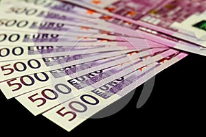 500 euro bills isolated on black