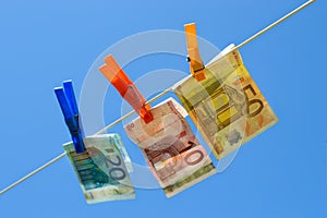 Euro bills on washing line