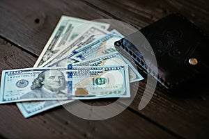 Euro cash and euro cents with brown leather wallet