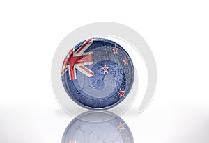 euro coin with new zealand flag on the white