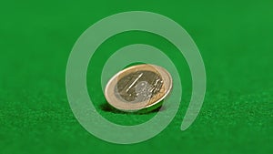 Euro coin spinning on casino table