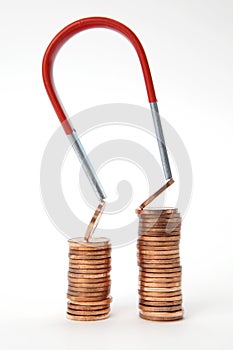 Euro coins attracted by a magnet