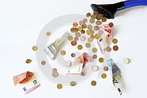 Euro coins and banknotes flow out of a watering can, financial principle to dump money at random, subsidies and grants that are