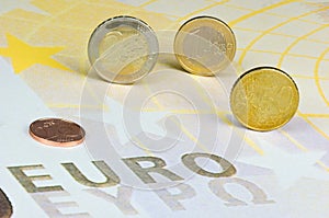 Euro-coins on Euro-banknote