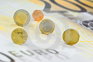 Euro-coins on Euro-banknote