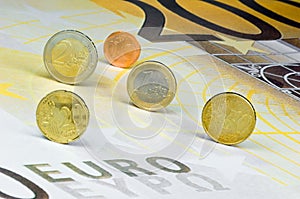 Euro-coins on Euro-banknote