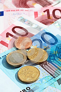 Euro coins and euro notes close up