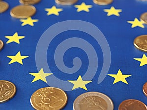 Euro coins, European Union, over flag