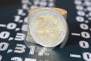 Euro coins, stock exchange and the price board