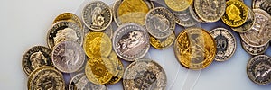 Euro coins, Swiss francs, the American dollar lie on a light background