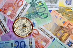 Euro and compass