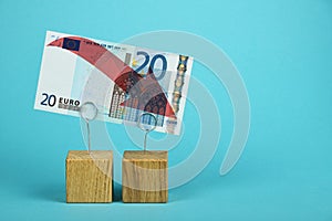 Euro currency decline illustrated over blue