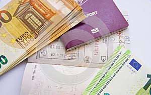 Euro currency and passport visa stamps