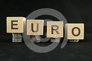 Euro currency weakening, value depreciation and devaluation concept. Decreasing stack of coins
