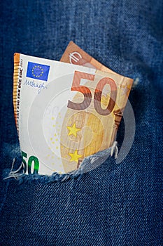 Euro in a denim hole