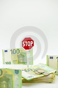 euro inflation.Stop euro currency. Refusal to pay in euros.Euro banknotes and stop sign on white background. The fall