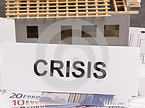 Euro and inscription crisis on housing plan. House under contruction. Crisis of real estate market. Reduced housing prices