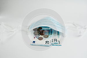 Euro and medicine on a white background