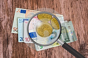 Euro money background with magnifying glass
