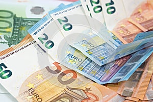 Euro money background from many euro banknotes in different value.