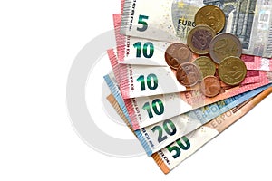 Euro money banknotes and coins on white background.  n white background. Euro notes and coins on the table. Copy space is on the l
