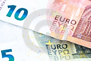 Euro money cash, 10 and 5 euro banknotes as a backdrop for topics such as economics, finance, savings and investment