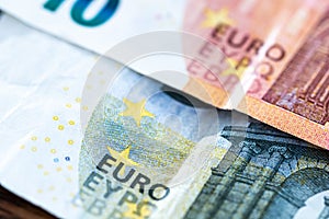 Euro money cash, 10 and 5 euro banknotes as a backdrop for topics such as economics, finance, savings and investment