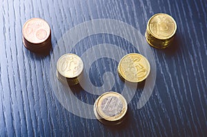 Euro money. Coins are on a dark background. Currency of Europe. Balance of money. Building from coins. Coins of different