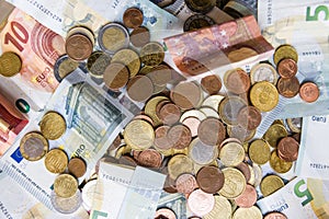 Euro money in coins and notes in a stack