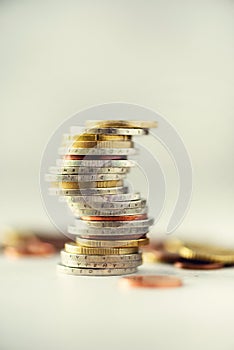 Euro money, currency. Success, wealth and poverty, poorness concept. Euro coins stack on grey background with copy space.