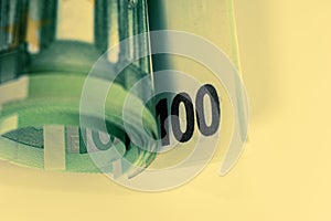 Euro money, Euro cash background. Banknotes of the european union on a white background. Close up. 100 euros roll.