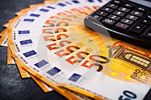 50 Euro Money. euro cash background. Lots of Euro money on the calculator. Banknotes background of Euros of Europe, EUR currency. photo