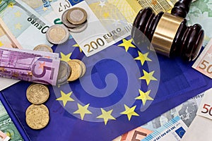 Euro money with hammer on eu flag