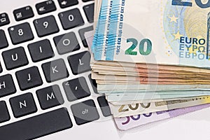 Euro money on laptop