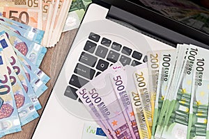 Euro money on laptop