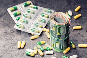 Euro money and medicaments. Euro banknotes and pills. photo