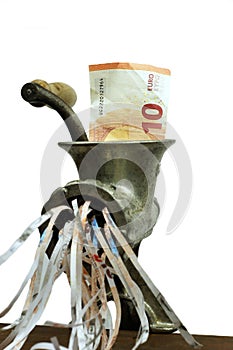 Euro note in a meat grinder