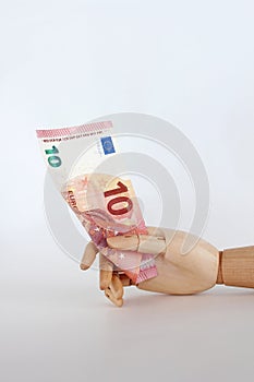 Euro notes in wooden hand-6