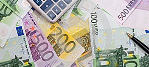 Euro paper cash with calculaor as finance background